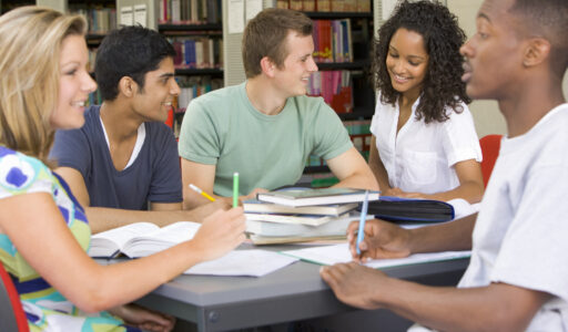 College students studying together in a library